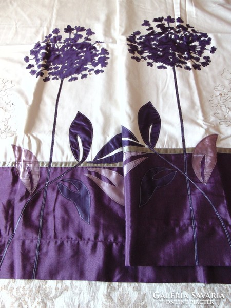 A pair of beautiful purple cream blackout curtains