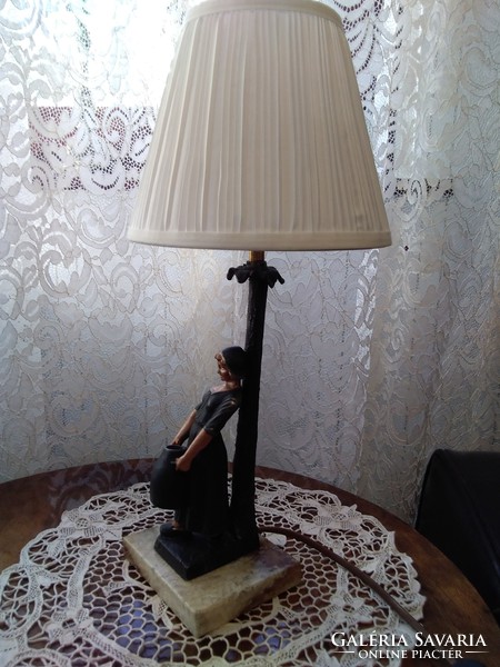 Old bedside lamp on a marble base with a cast metal female figure.