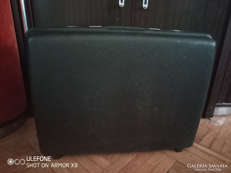 A vintage black Samsonite suitcase from the 1960s in good condition