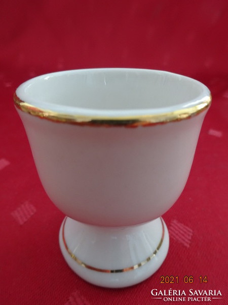 German porcelain egg cup, little boy on the side with gilded border. He has!