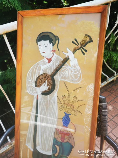 Chinese woman playing musical instrument