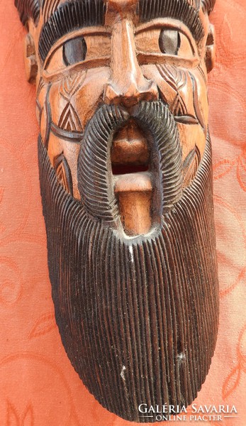 Old oriental wooden wall mask