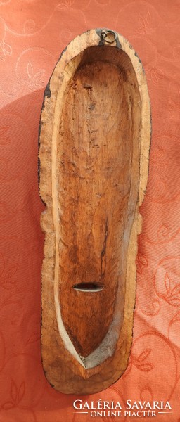 Old oriental wooden wall mask