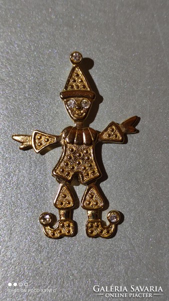 Gilded or gold-colored clown pendant with moving hands, feet, and head