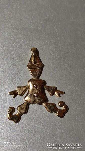 Gilded or gold-colored clown pendant with moving hands, feet, and head