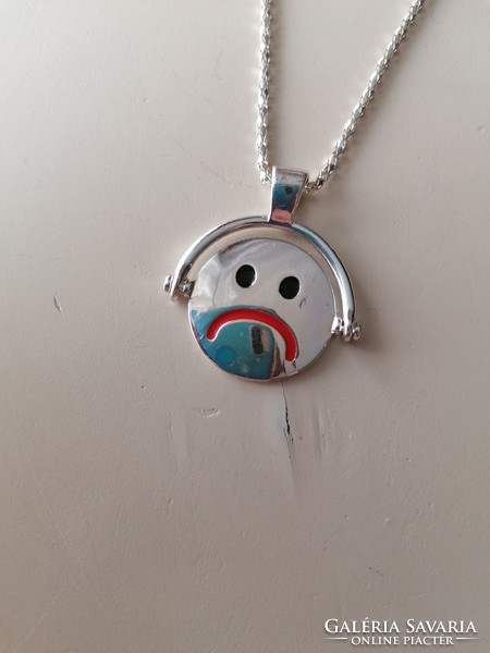 Bizsu necklace with a happy and sad rotating pendant