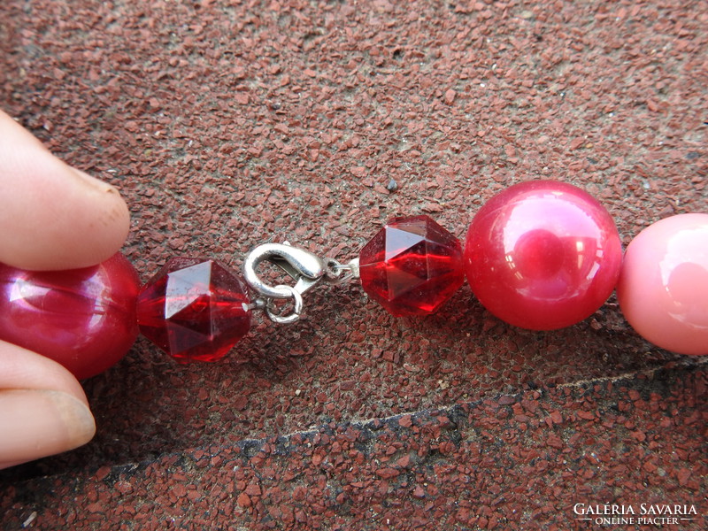 Crimson string of pearls