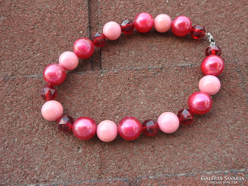 Crimson string of pearls