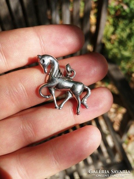 Silver horse, riding pendant