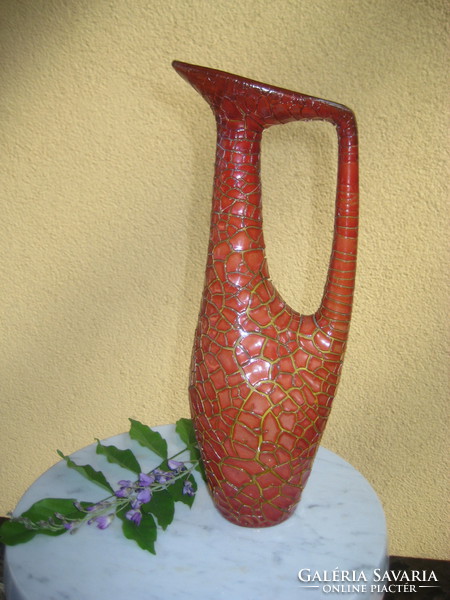 Small professional repair on the mouth of Zsolnay's cracked, oxblood-glazed vase with ears