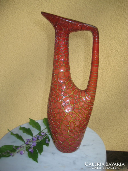 Small professional repair on the mouth of Zsolnay's cracked, oxblood-glazed vase with ears