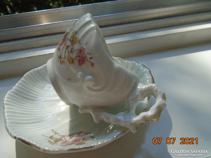 Antique ribbed embossed shell cup with saucer and laced tongs