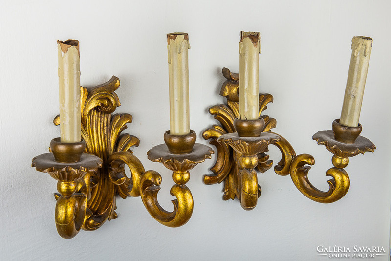 Pair of richly carved and gilded candlesticks