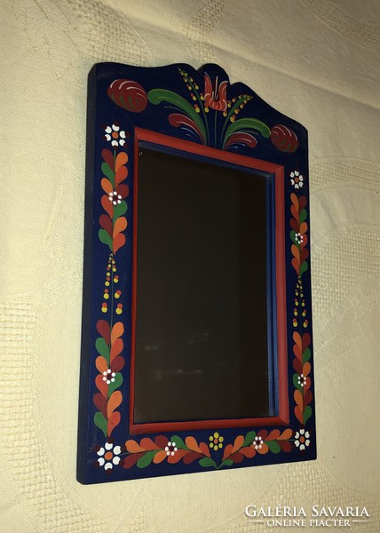 Wall mirror with a folk motif
