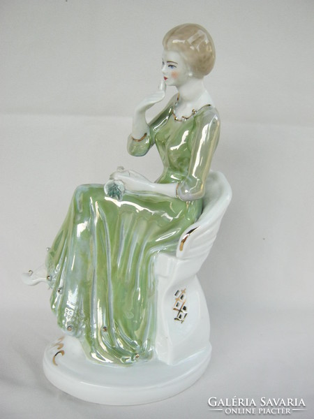 Retro ... Woman sitting on a large porcelain chair