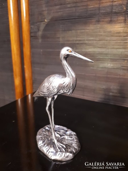 Silver stork statue