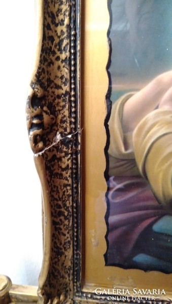 Jesus prays to the Almighty — in a holy image — in an antique blonde frame