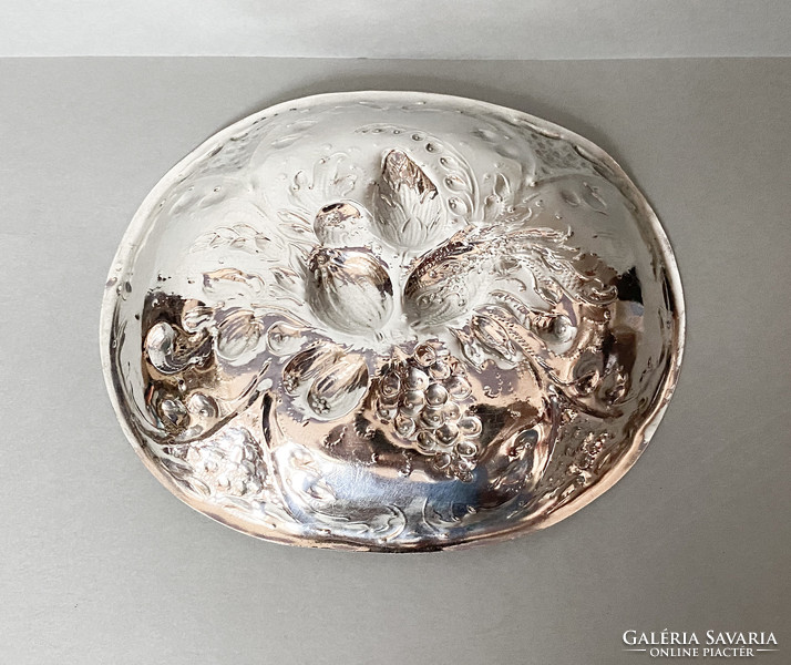 Old richly decorated silver bowl.