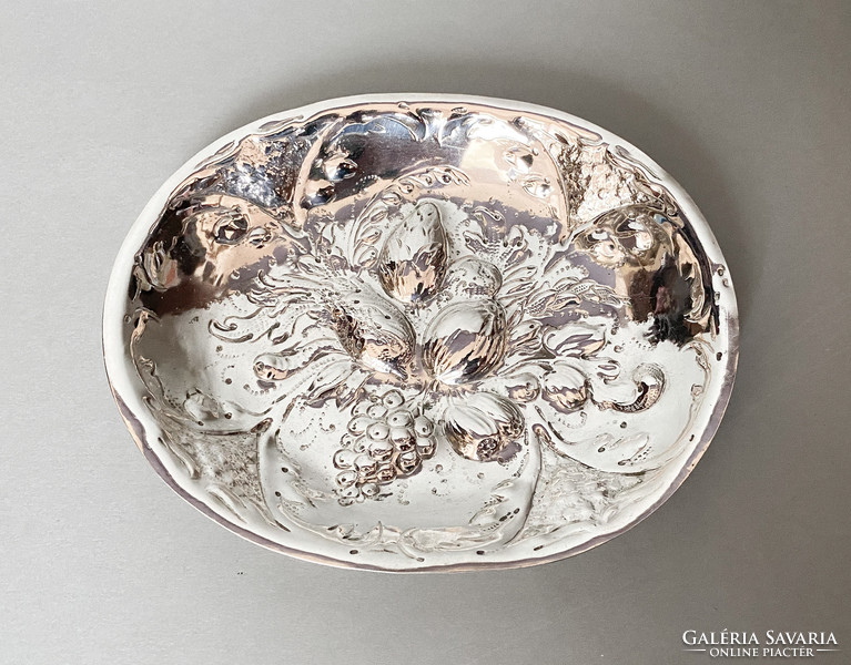 Old richly decorated silver bowl.