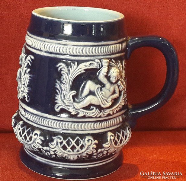 Blue glazed putto ceramic jug
