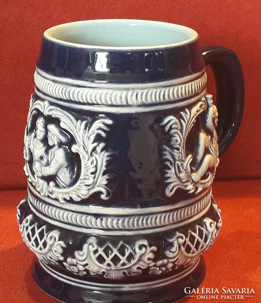Blue glazed putto ceramic jug