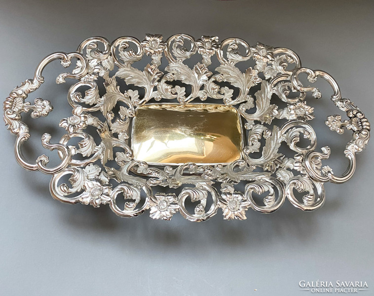Ornate antique silver offering with gilded insert.