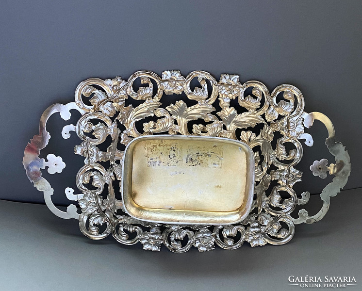 Ornate antique silver offering with gilded insert.