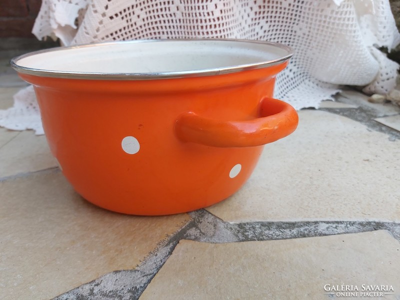 Beautiful yellow orange polka dot enamel bowl in a peasant bowl, like a peasant pot