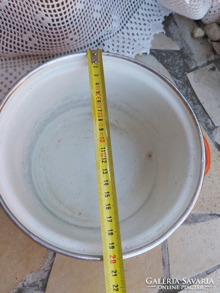 Beautiful yellow orange polka dot enamel bowl in a peasant bowl, like a peasant pot