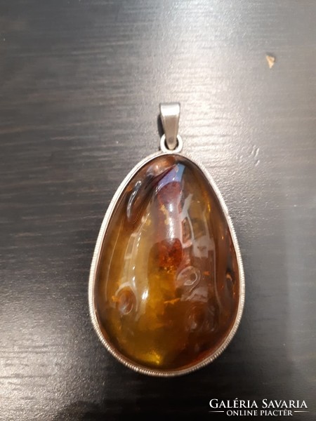 Polish amber pendant with a small tree inside