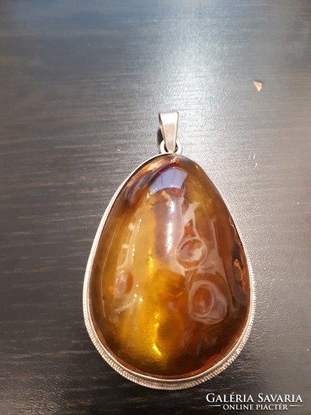 Polish amber pendant with a small tree inside
