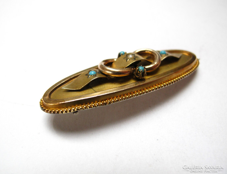 Antique gilded silver brooch with turquoise.