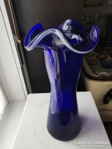 Blue glass vase, broken glass