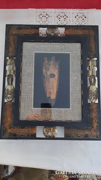 African mask made of copper, under glass, in a hand-carved frame. He has!