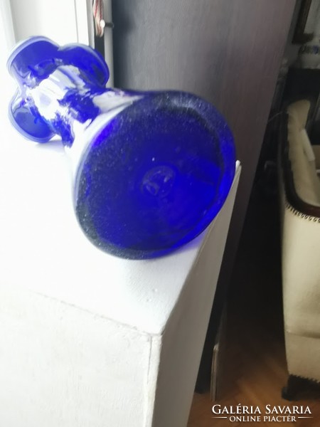 Blue glass vase, broken glass