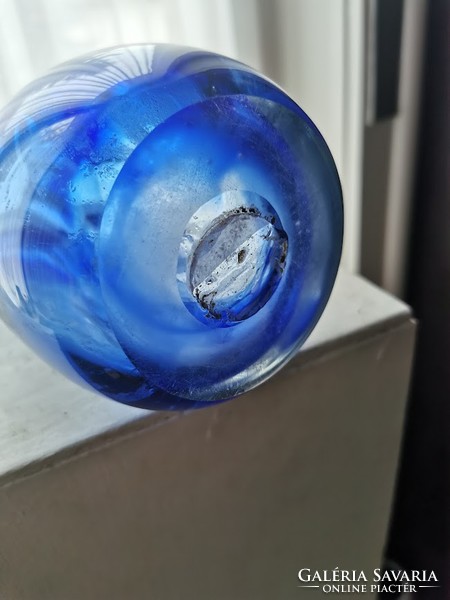 Blue glass vase, broken glass