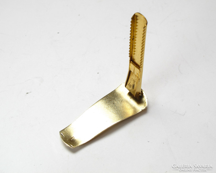 Gilded silver tie clip.