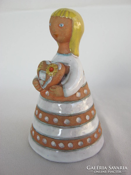 Signed ceramic little girl holding a gingerbread heart in her hand