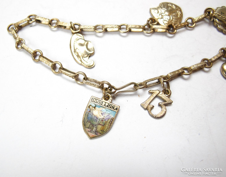 Silver bracelet with 6 charms.