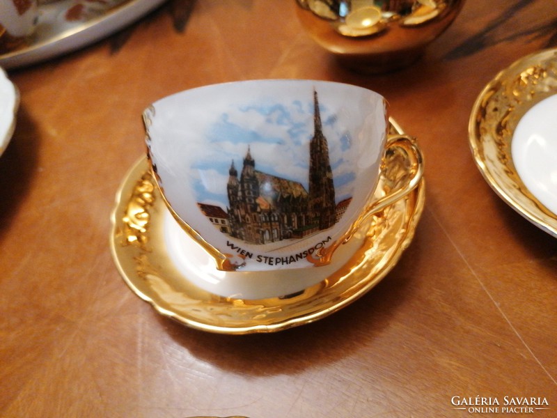 Dazzling, Austrian coffee set with rich gold cover, famous Viennese buildings in display case