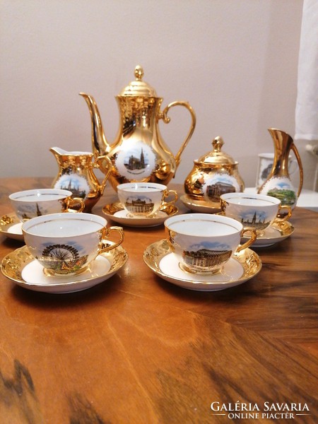 Dazzling, Austrian coffee set with rich gold cover, famous Viennese buildings in display case