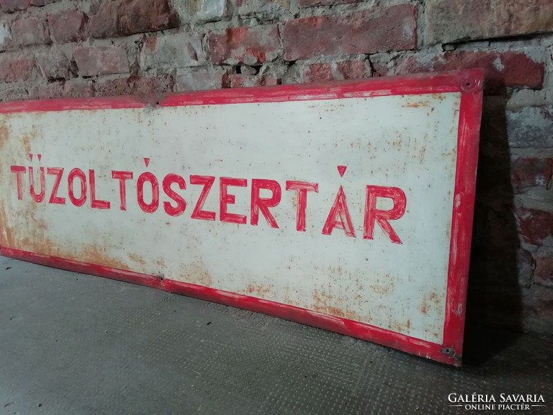 Hand painted fire station labeled sign in loft