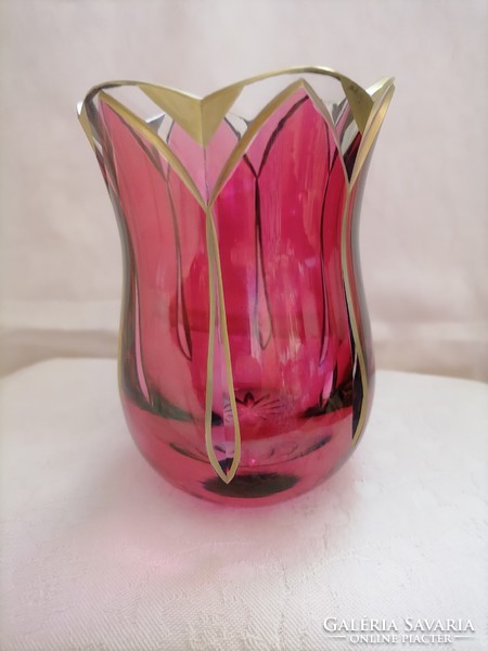 Purple-gold marked tulips in a glass vase