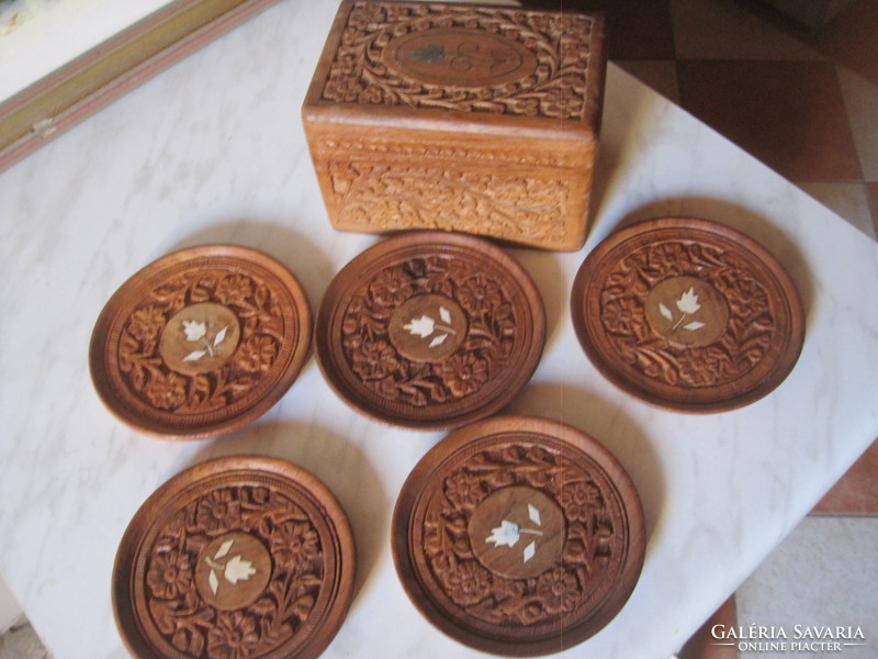 Oriental jewelry box with 5 carved wooden cup coasters.