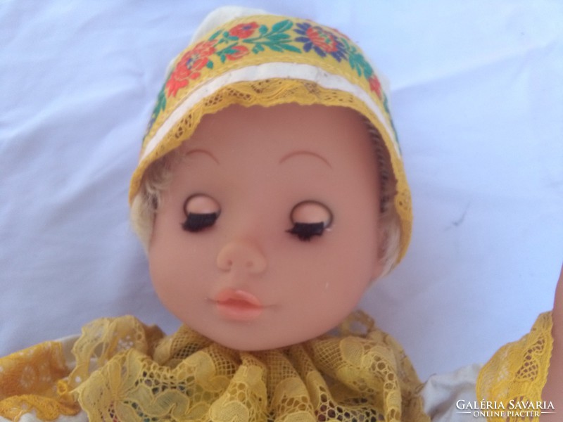 Old sleeping baby in folk costume with laced hair - 54 cm