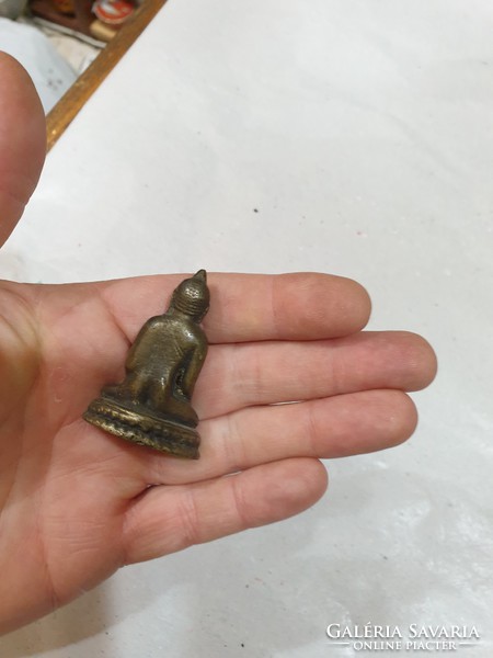 Copper buddha figurine