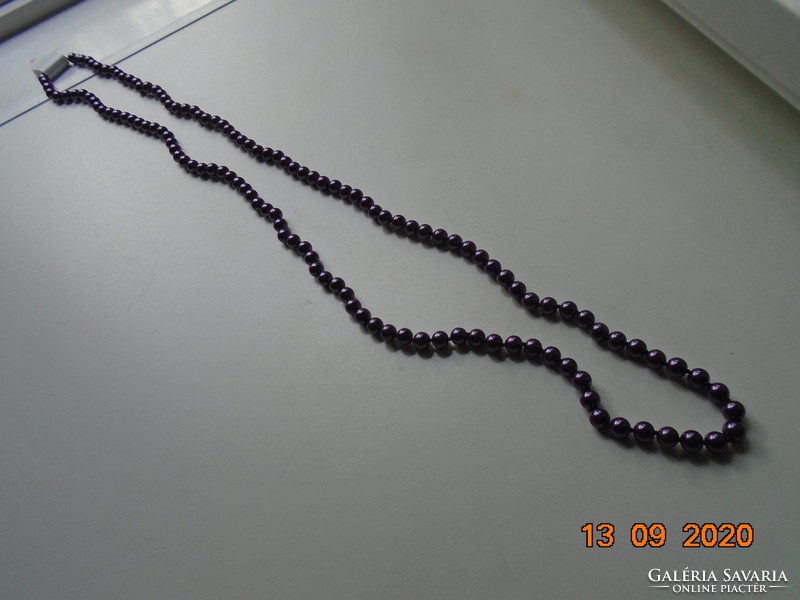 Long necklace made of hand-crocheted purple beads