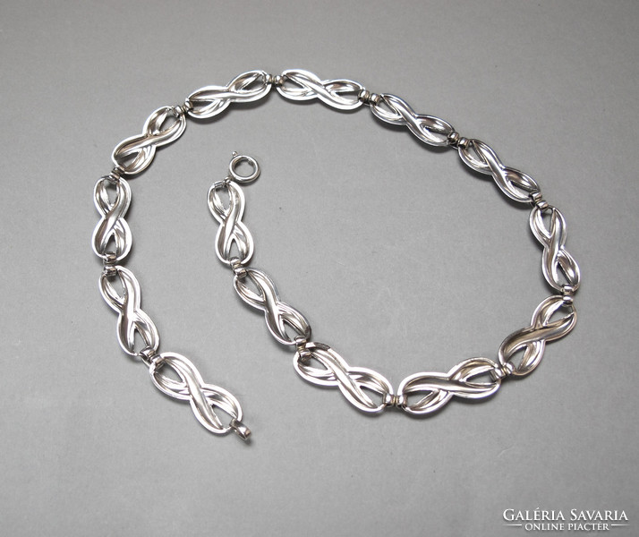 Showy silver necklace.