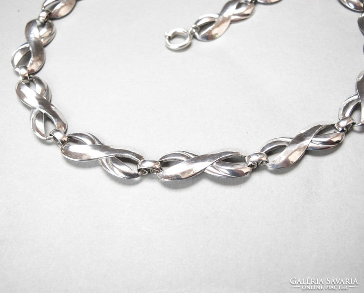 Showy silver necklace.