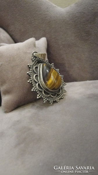 Tibetan silver pendant with tiger eyes